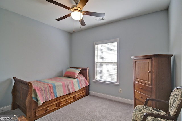 carpeted bedroom featuring ceiling fan