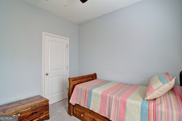 bedroom featuring ceiling fan and light carpet