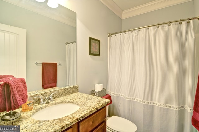 bathroom featuring crown molding, vanity, and toilet