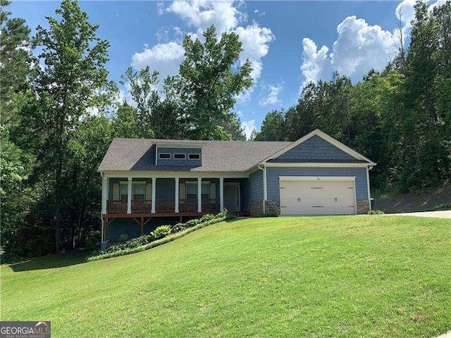 view of front of property with a garage and a front yard