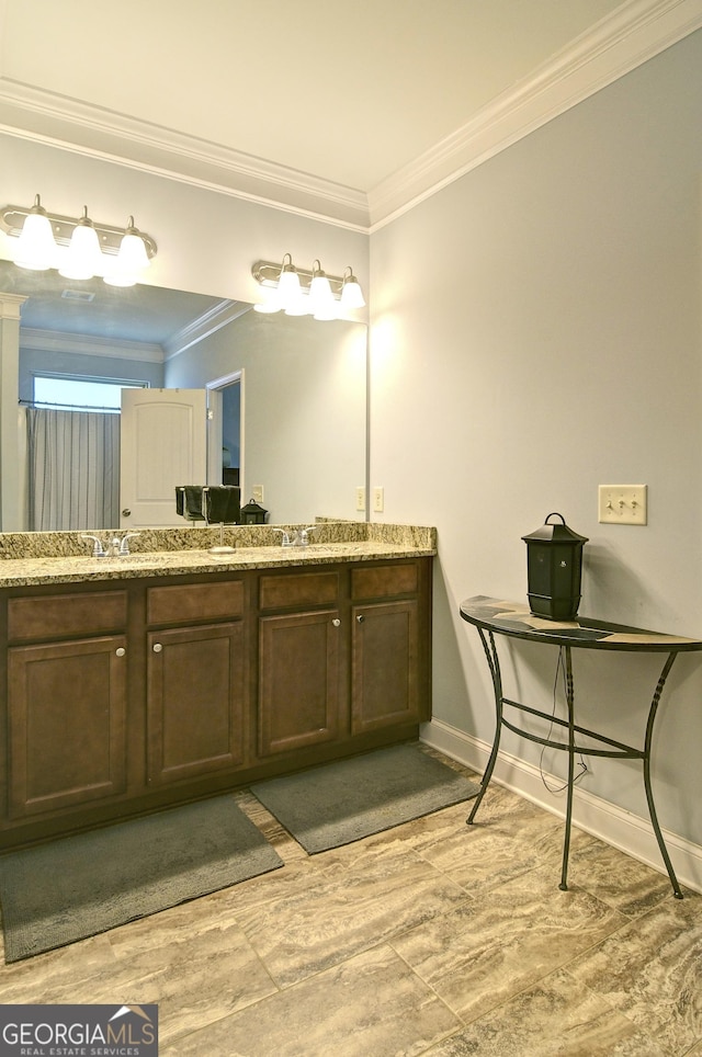 bathroom featuring vanity and ornamental molding