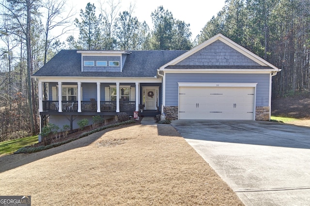 craftsman house with a garage and covered porch