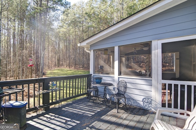 wooden terrace featuring a sunroom