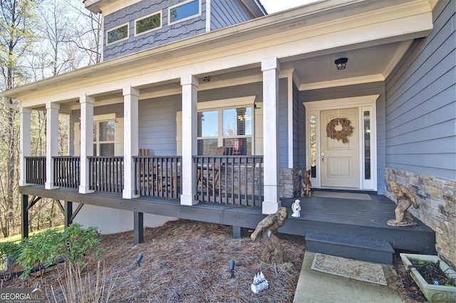 doorway to property featuring a porch