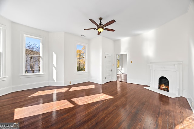 unfurnished living room with hardwood / wood-style flooring and ceiling fan