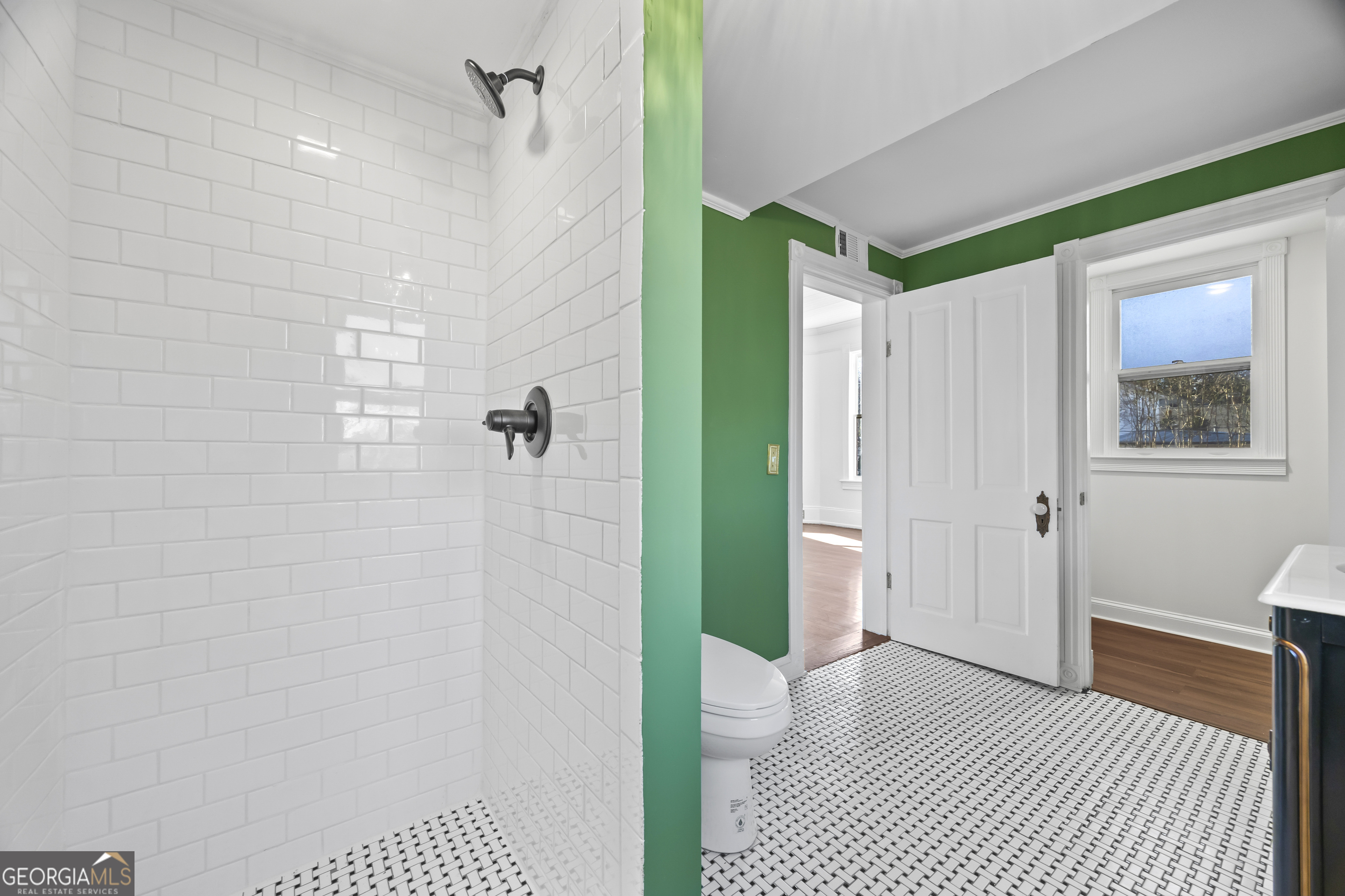 198 Dearing St, Athens, GA 30605 - bathroom with toilet, ornamental molding, vanity, and tiled shower