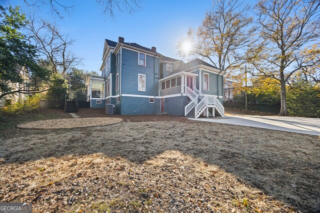 198 Dearing St, Athens, GA 30605 - rear view of house featuring central AC, a chimney, and stairway