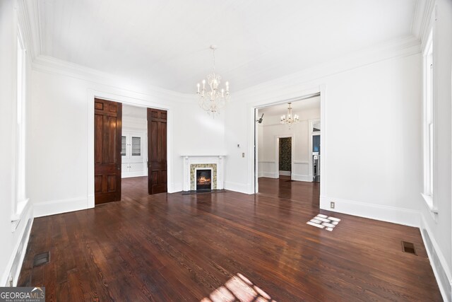 198 Dearing St, Athens, GA 30605 - unfurnished living room featuring wood finished floors, visible vents, and an inviting chandelier