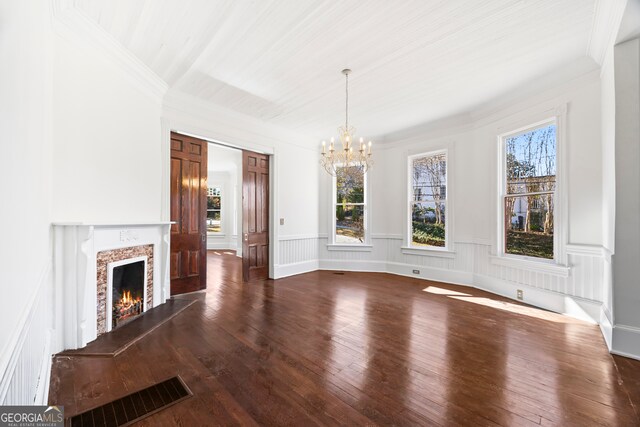 198 Dearing St, Athens, GA 30605 - unfurnished living room featuring crown molding, a chandelier, visible vents, a premium fireplace, and dark wood-style floors