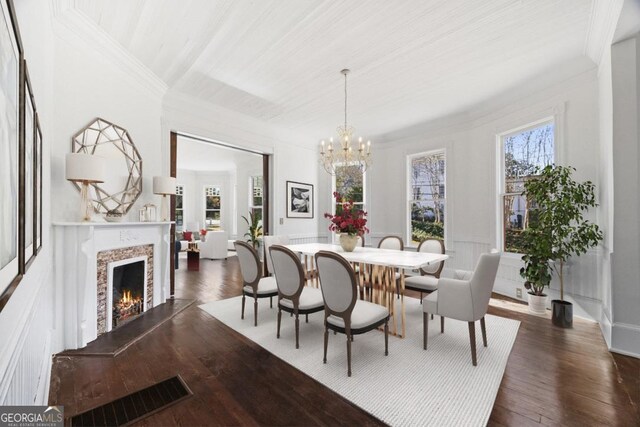 198 Dearing St, Athens, GA 30605 - dining room with visible vents, dark wood-style floors, a fireplace, and a chandelier