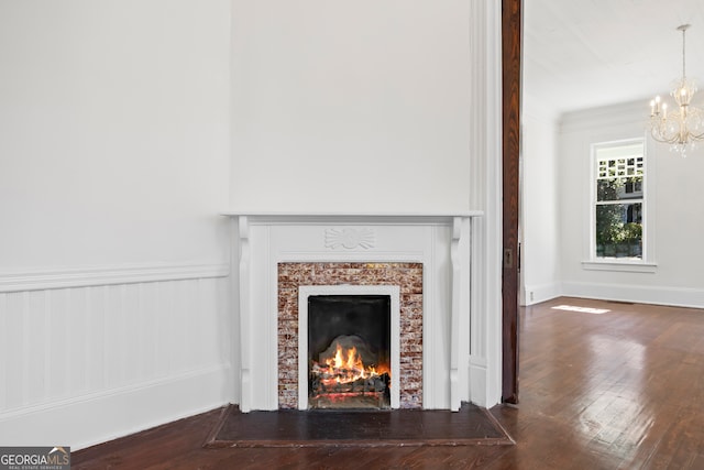 198 Dearing St, Athens, GA 30605 - details featuring a fireplace, wood finished floors, and a notable chandelier
