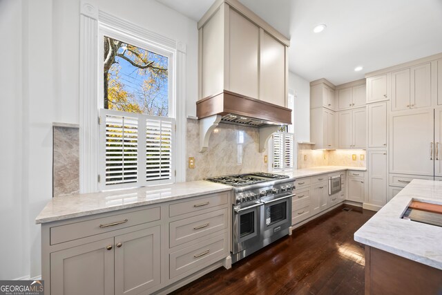 198 Dearing St, Athens, GA 30605 - kitchen featuring light stone countertops, backsplash, appliances with stainless steel finishes, and dark wood-style flooring
