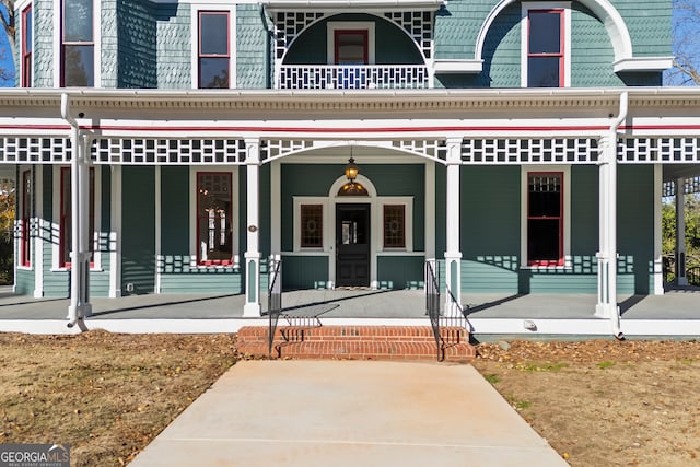 doorway to property with a porch