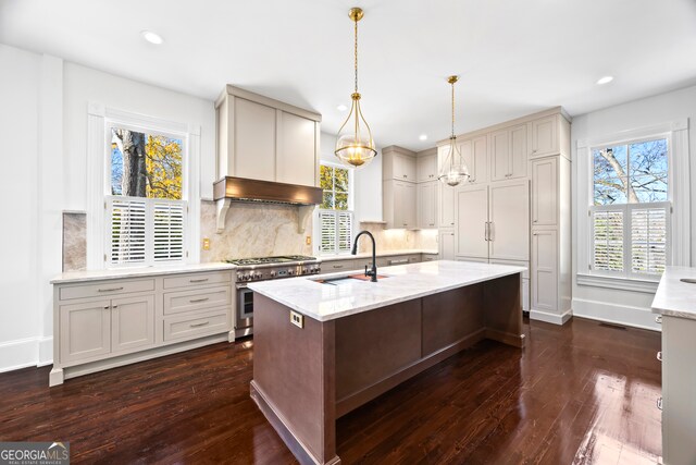 198 Dearing St, Athens, GA 30605 - kitchen with a sink, backsplash, range with two ovens, and dark wood-style flooring