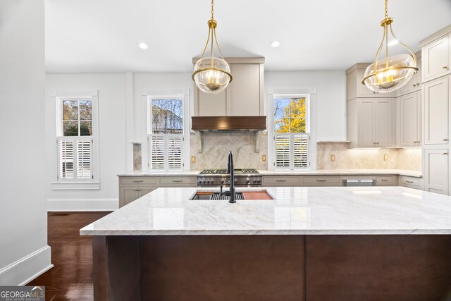 198 Dearing St, Athens, GA 30605 - kitchen with backsplash, baseboards, light stone counters, and a sink