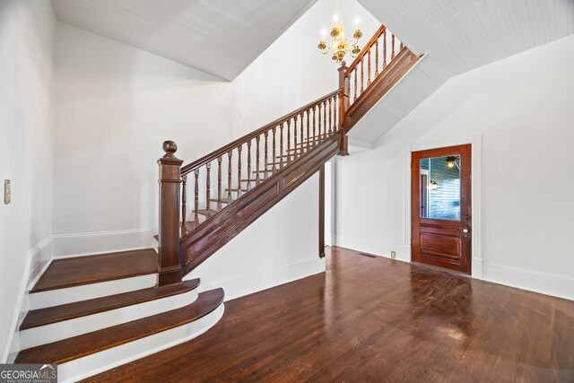 198 Dearing St, Athens, GA 30605 - entryway featuring vaulted ceiling, wood finished floors, stairs, an inviting chandelier, and baseboards