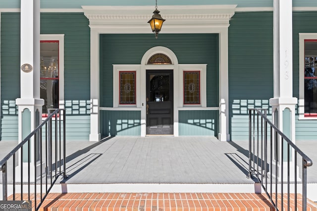 doorway to property featuring covered porch