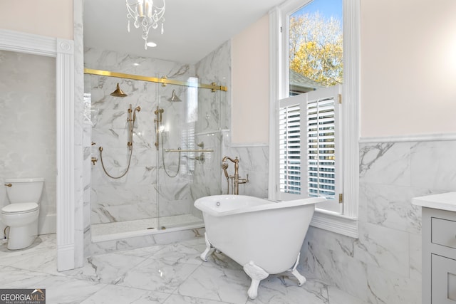 bathroom featuring vanity, plus walk in shower, a healthy amount of sunlight, and an inviting chandelier