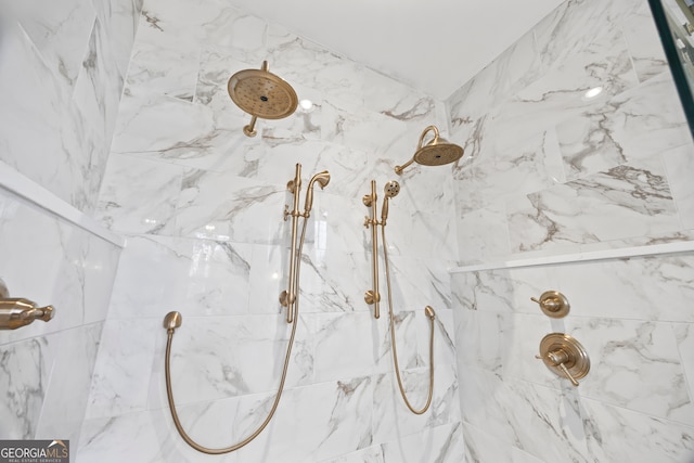 interior details featuring tiled shower