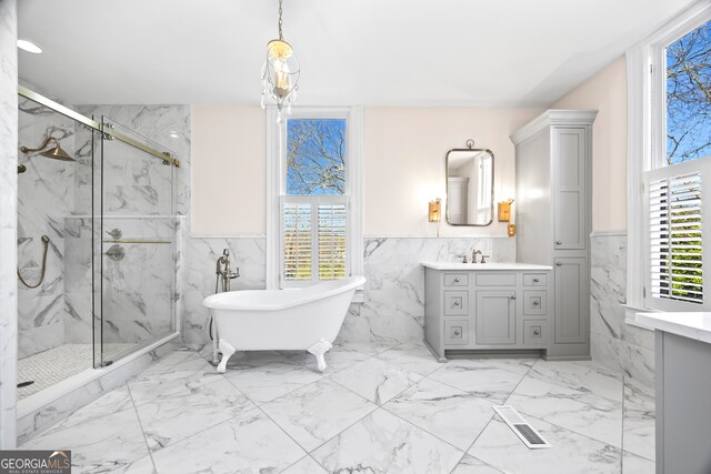 198 Dearing St, Athens, GA 30605 - bathroom with plenty of natural light, marble finish floor, and a marble finish shower