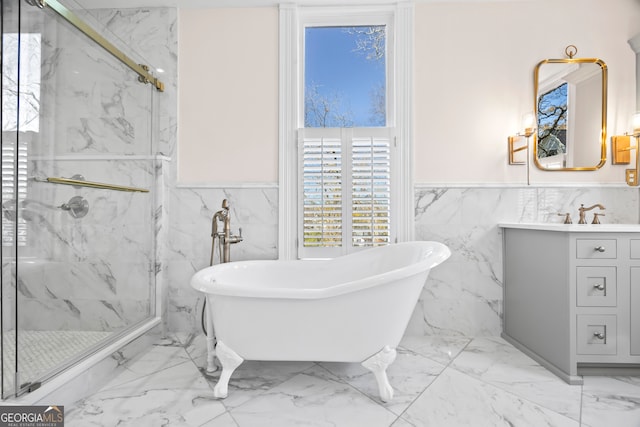 bathroom with vanity, tile walls, and independent shower and bath