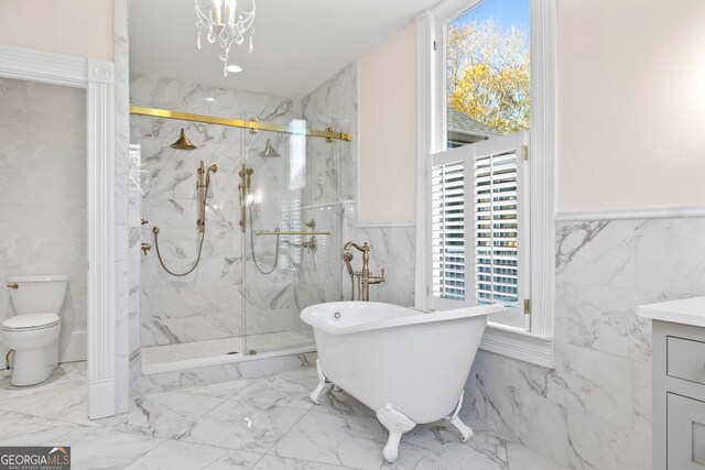 198 Dearing St, Athens, GA 30605 - full bathroom featuring tile walls, a wealth of natural light, toilet, and a marble finish shower
