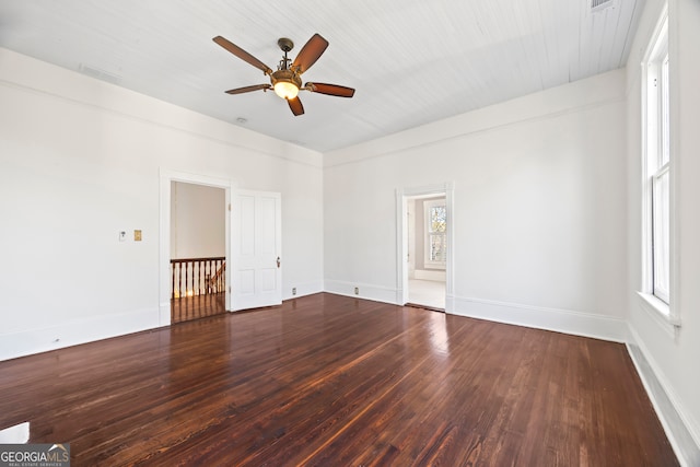 spare room with ceiling fan and dark wood-type flooring