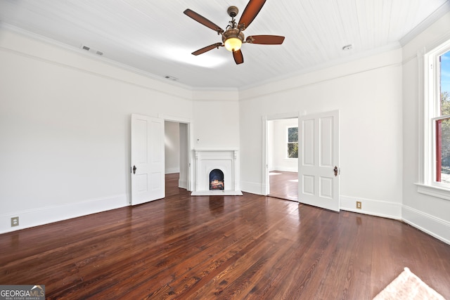 unfurnished living room with crown molding, dark hardwood / wood-style flooring, and ceiling fan