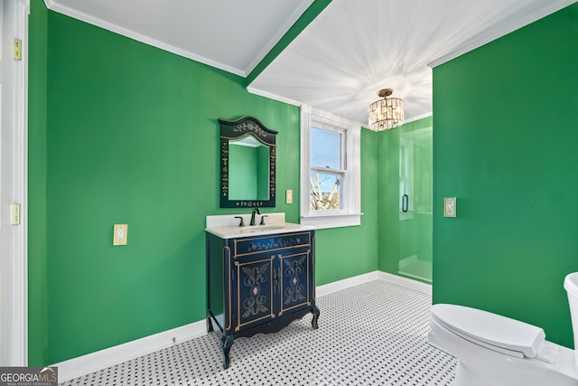 bathroom with crown molding, vanity, a notable chandelier, and toilet