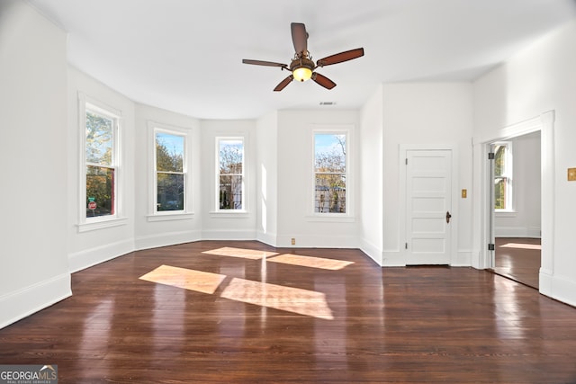 interior space with ceiling fan and dark wood-type flooring