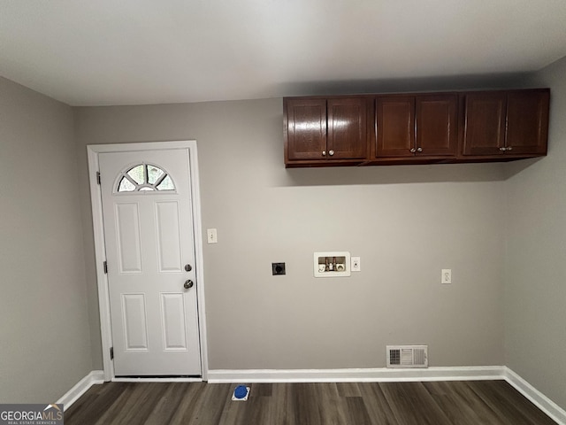 laundry area with electric dryer hookup, dark wood-type flooring, hookup for a washing machine, and cabinets