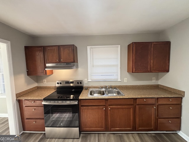 kitchen featuring stainless steel range with electric stovetop, sink, and dark hardwood / wood-style floors