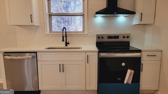 kitchen with sink, white cabinets, stainless steel appliances, and custom exhaust hood