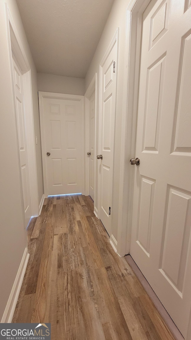 hallway featuring light hardwood / wood-style floors