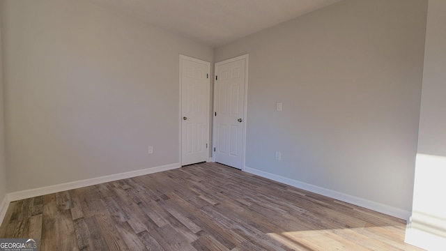 unfurnished room featuring light hardwood / wood-style flooring