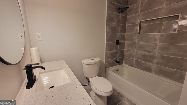 full bathroom featuring vanity, toilet, and tiled shower / bath