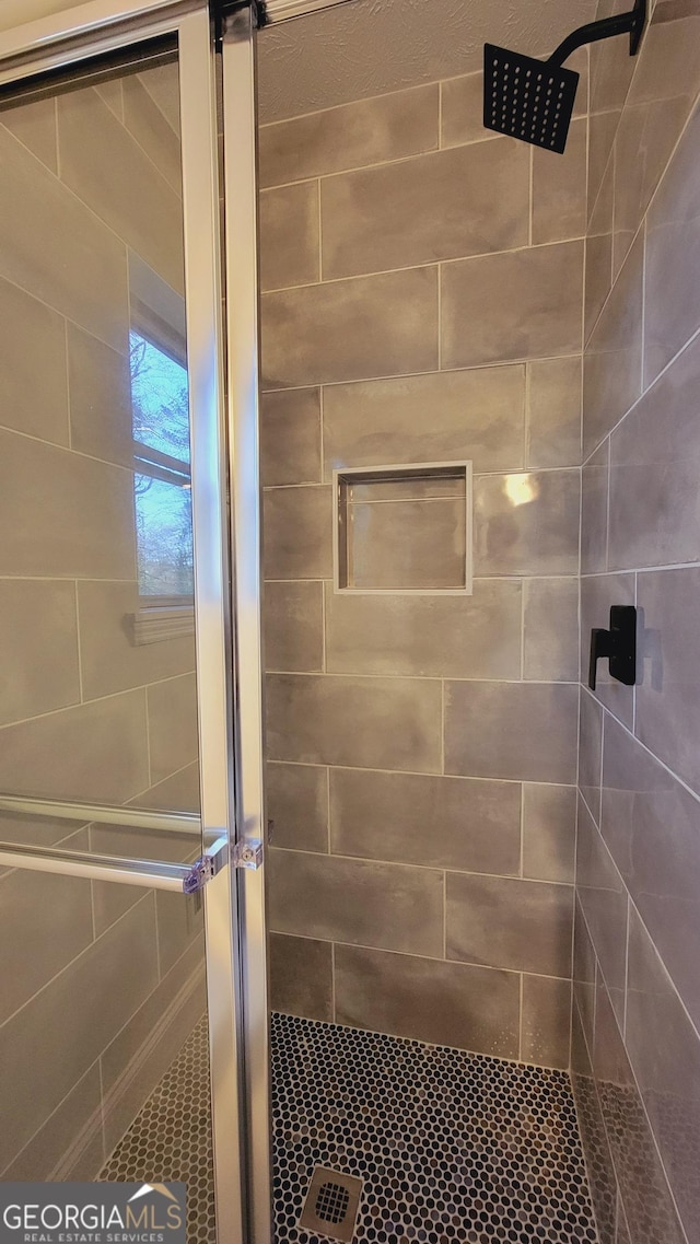 bathroom featuring walk in shower