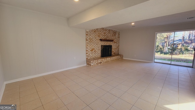 unfurnished living room featuring light tile patterned floors and a fireplace