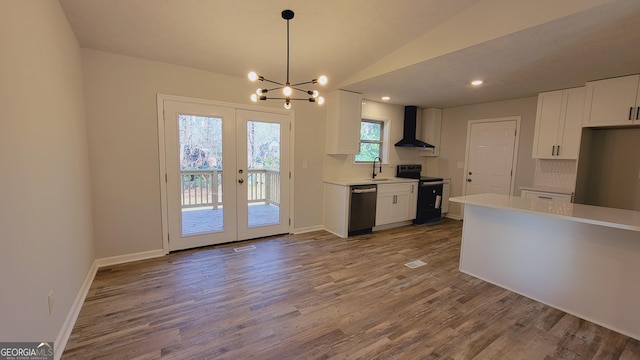 kitchen featuring white cabinets, electric range, stainless steel dishwasher, and wall chimney exhaust hood