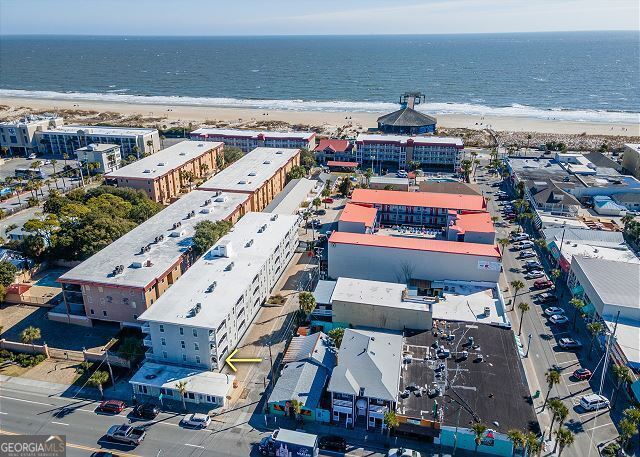 aerial view featuring a water view and a beach view