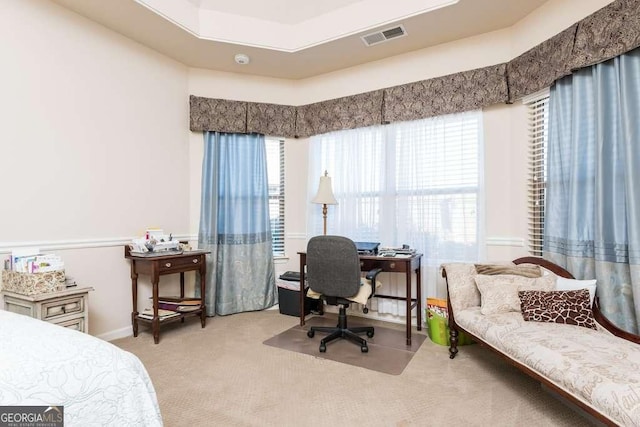 bedroom with light colored carpet