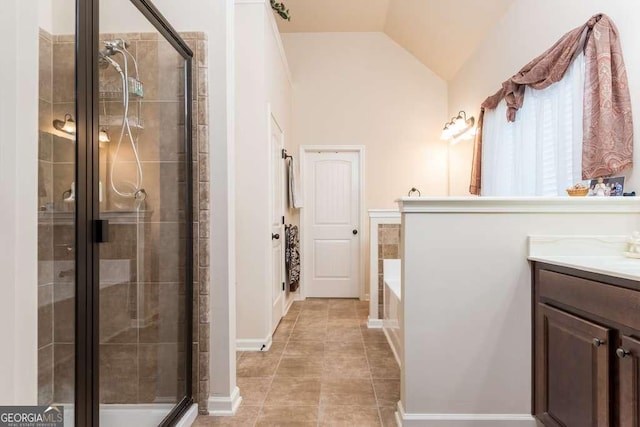 bathroom with tile patterned flooring, vanity, a shower with shower door, and lofted ceiling