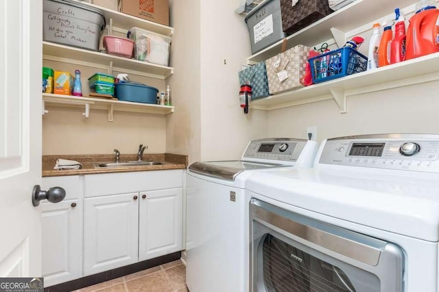 laundry area featuring independent washer and dryer and sink