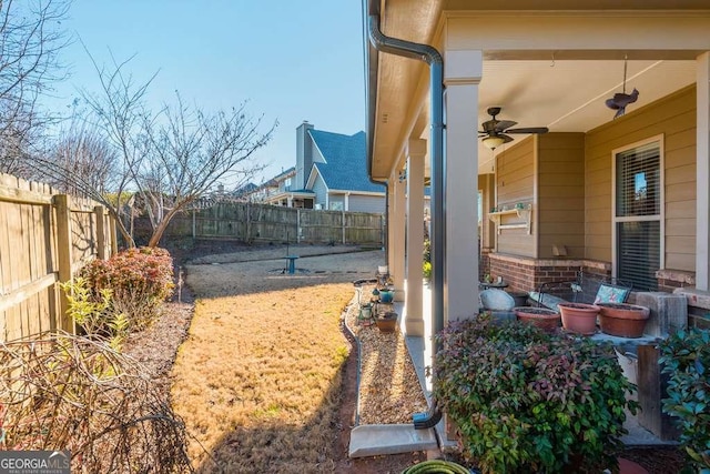 view of yard with ceiling fan