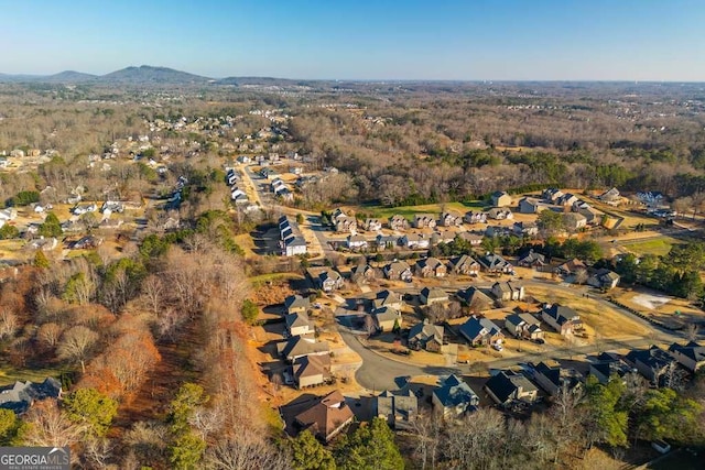 birds eye view of property with a mountain view