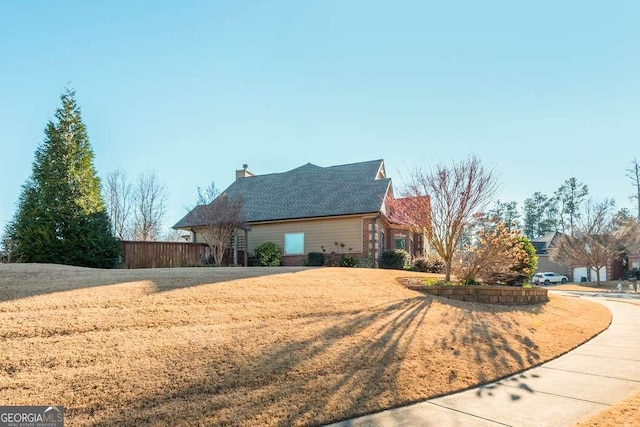 view of home's exterior featuring a lawn