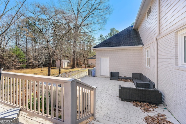 wooden terrace with a storage unit and central air condition unit