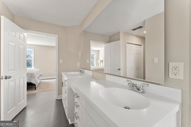 bathroom with hardwood / wood-style flooring and vanity