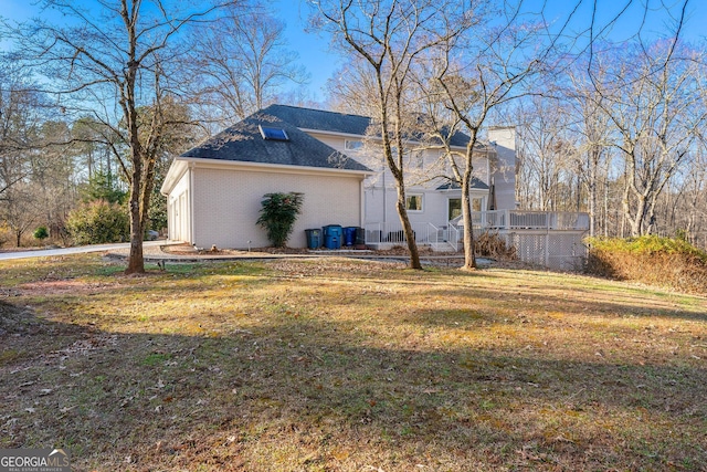 view of property exterior with a yard