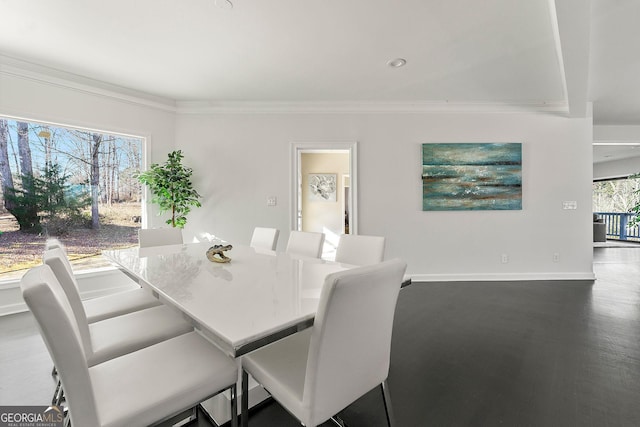 dining room featuring dark hardwood / wood-style flooring and crown molding